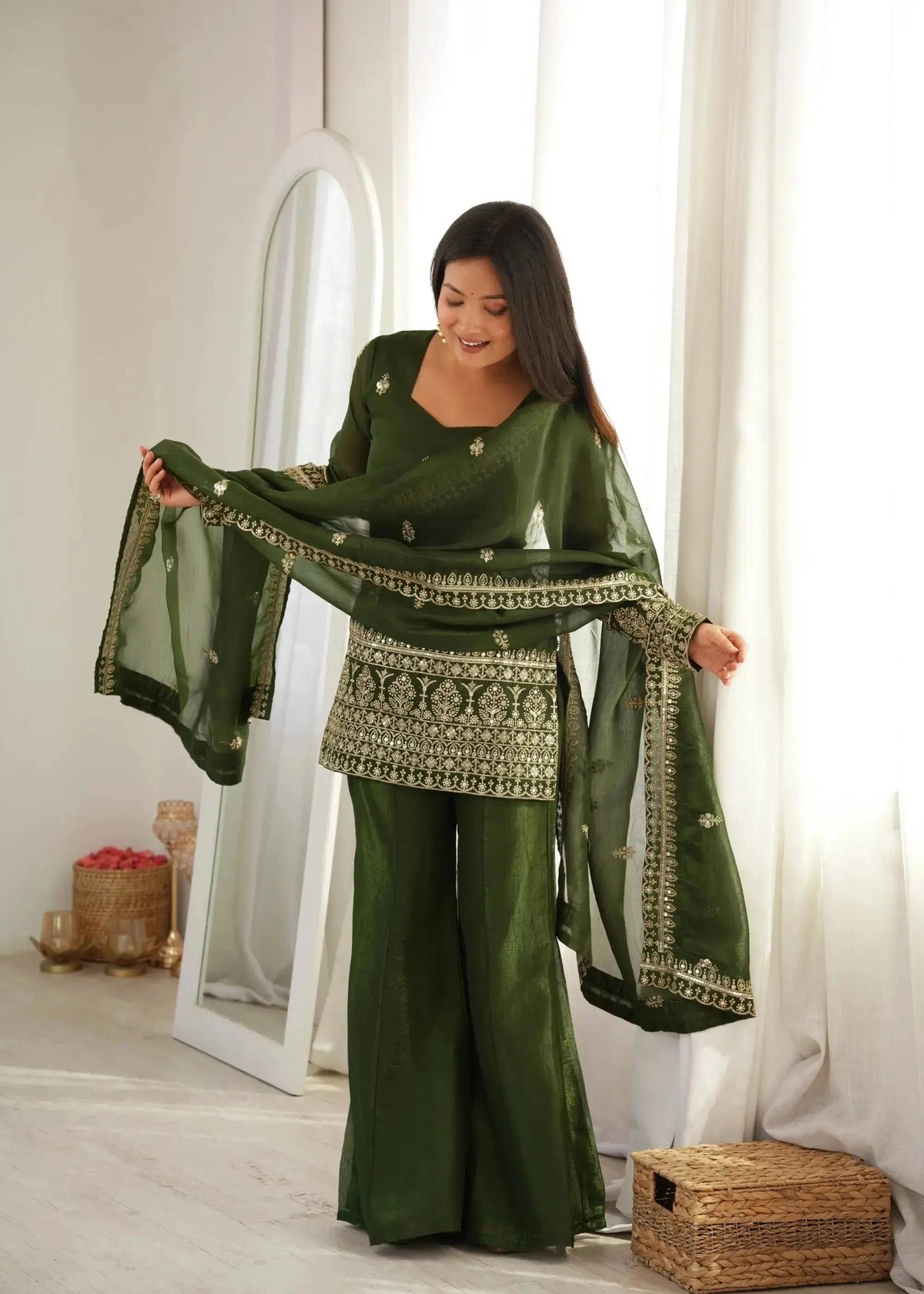 Olive Green Sequins Embroidered Zari Suit — model holding dupatta with bell bottom pant