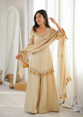 KU212 Beige Doremon Crush Suit – Model holding dupatta spread wide showing tassel border, V-neck mirror work and wide Palazzo pants