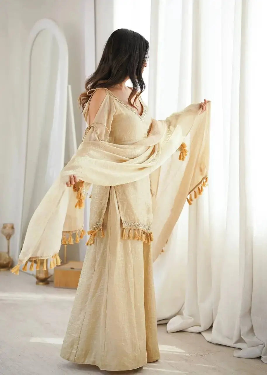 KU212 Beige Mirror Work Suit – Back/side view with dupatta held spread showing full Palazzo width and tassel border