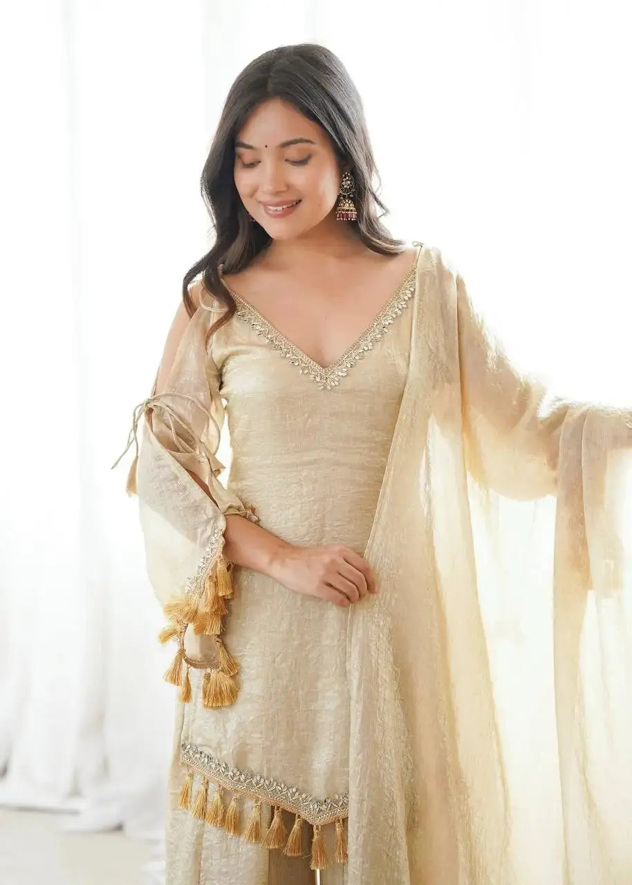 KU212 Beige Suit – Portrait with model looking down, close-up view of V-neck mirror work neckline and cold shoulder sleeves with dupatta