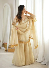 KU212 Beige Suit – Three-quarter view with dupatta draped over arm showing mirror work neckline, cold shoulder sleeves and tassel hem border