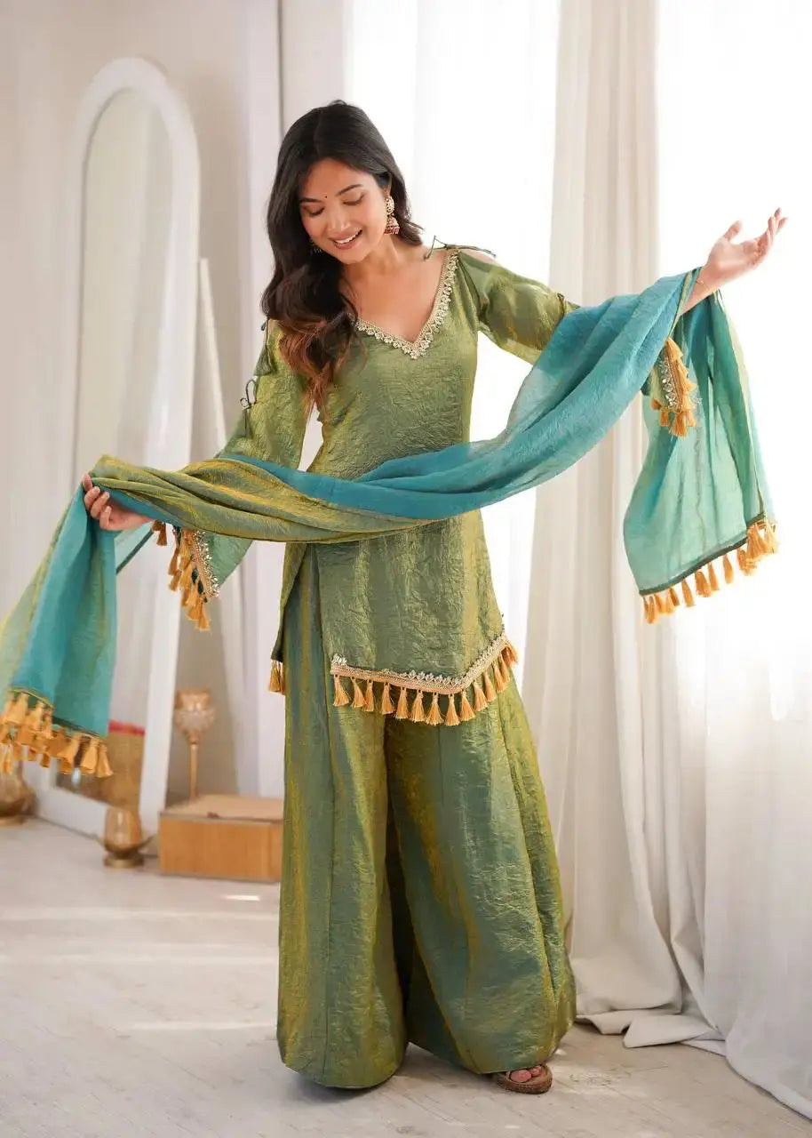 Green Suit – angled full-length shot showing V-neck mirror work and hem tassels