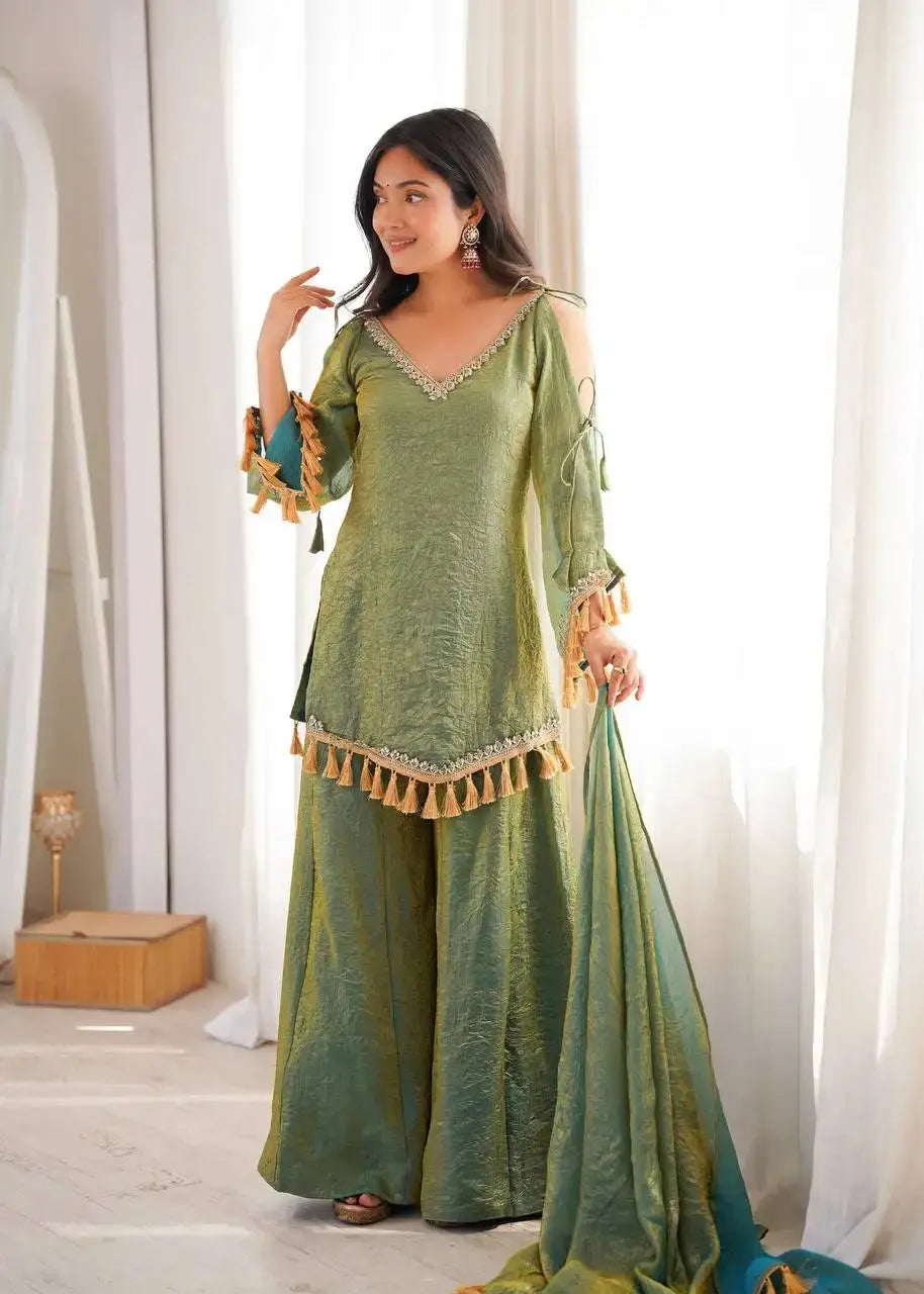 Green Suit – full-length side-angle view with bell sleeves extended