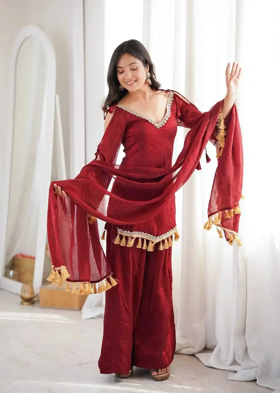 Maroon Suit – angled full-length shot showing V-neck mirror work and hem tassels