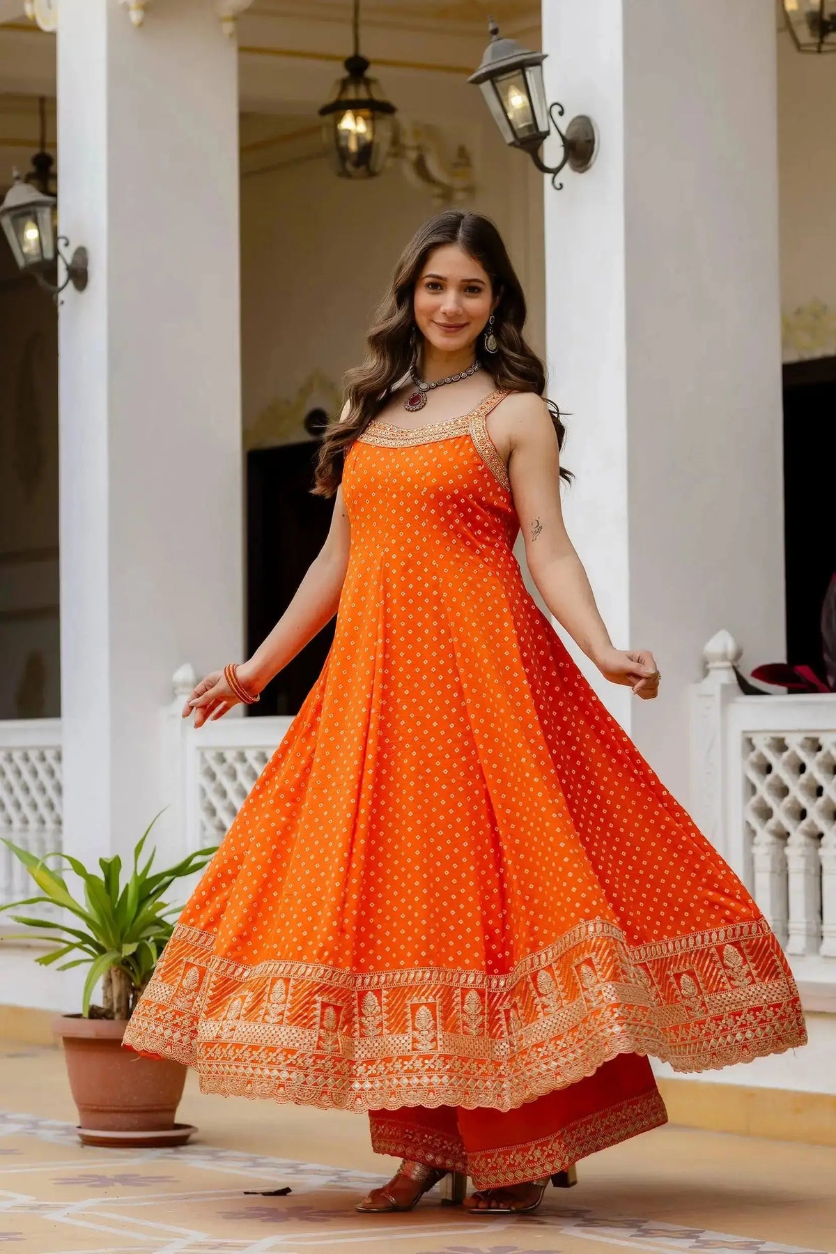 Orange Anarkali Suit – close-up of gold mirror work and sequins on yoke