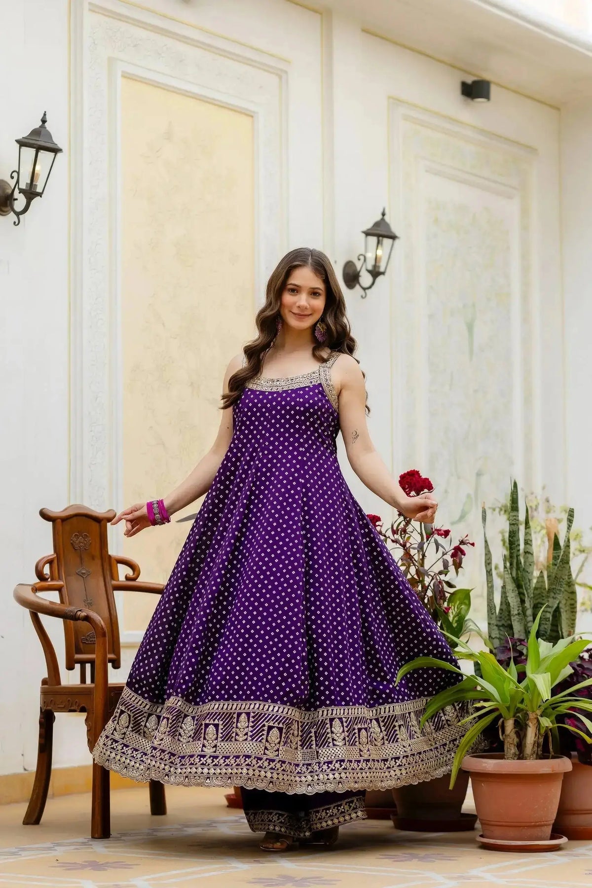 KU215 Purple Embroidered Anarkali Suit – Flair pose without dupatta, showing wide A-line silhouette, gold zari temple border and sleeveless design