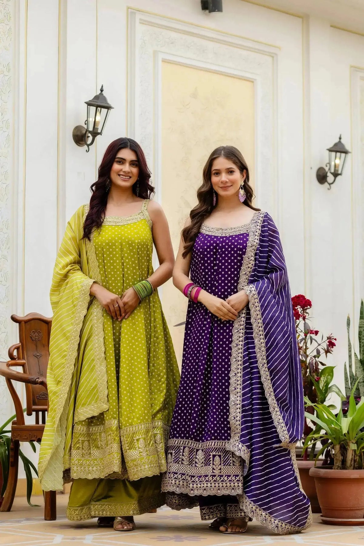 KU215 Purple Embroidered Anarkali Suit alongside green variant – Both models in full-length view showing gold zari border and Striped Lurex dupattas