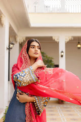 Grayish Blue Heavy Embroidered Suit KU216 – Dupatta draped over head in traditional style, coral-pink with gold Zari border
