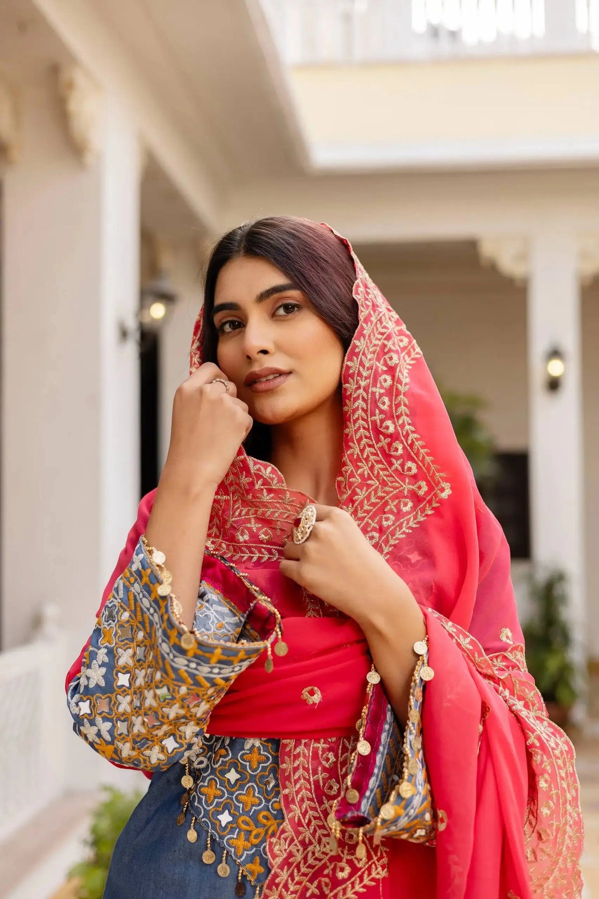 KU216 Grayish Blue Suit – Close-up portrait with coral dupatta on head, embroidered sleeve and coin tassels visible
