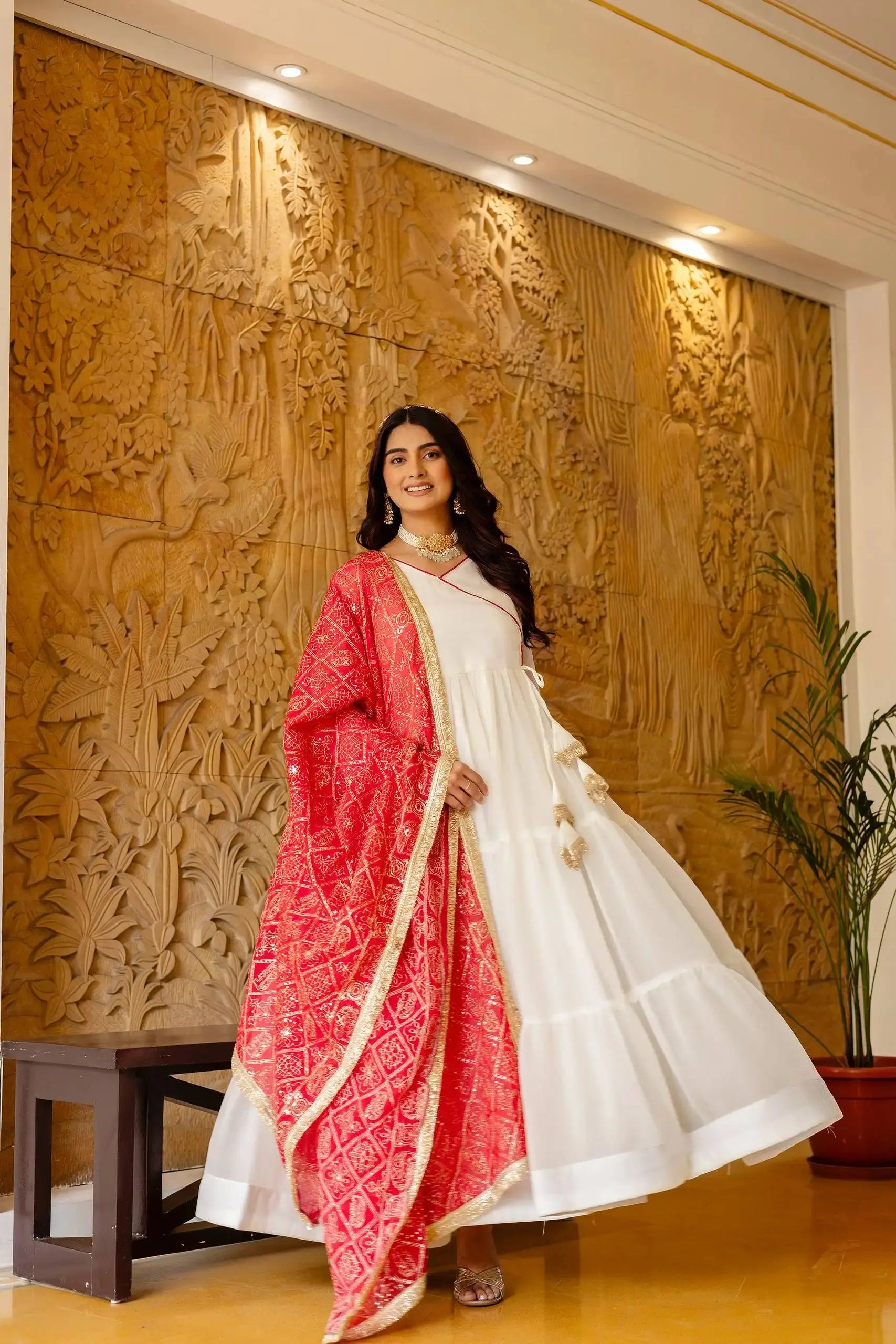 KU217 White Anarkali Suit – Flair pose showing tiered Anarkali silhouette width with dark pink dupatta