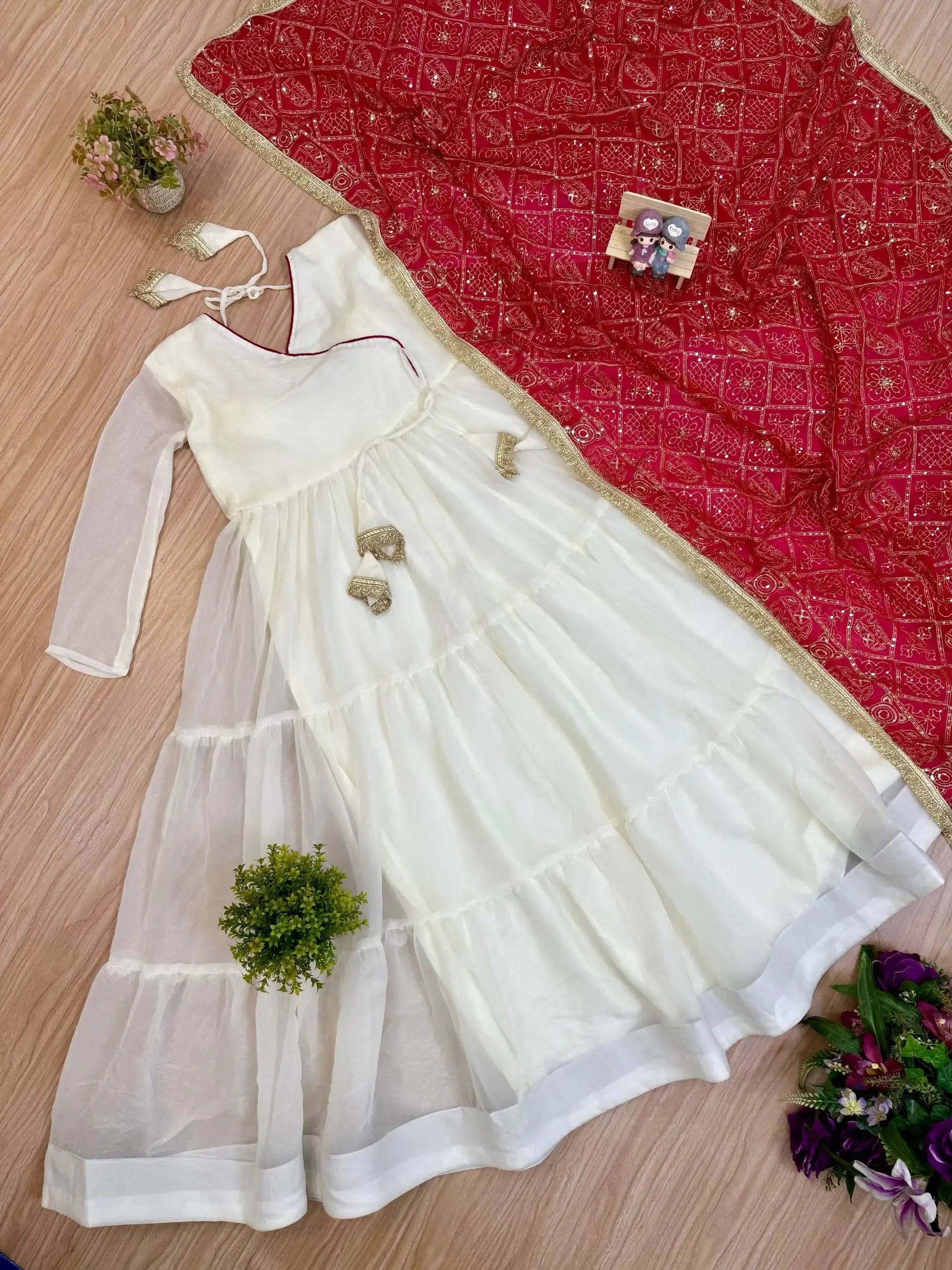 KU217 White Anarkali Suit flat lay – Complete 2-piece set: white tiered Anarkali and dark pink Bandhej dupatta