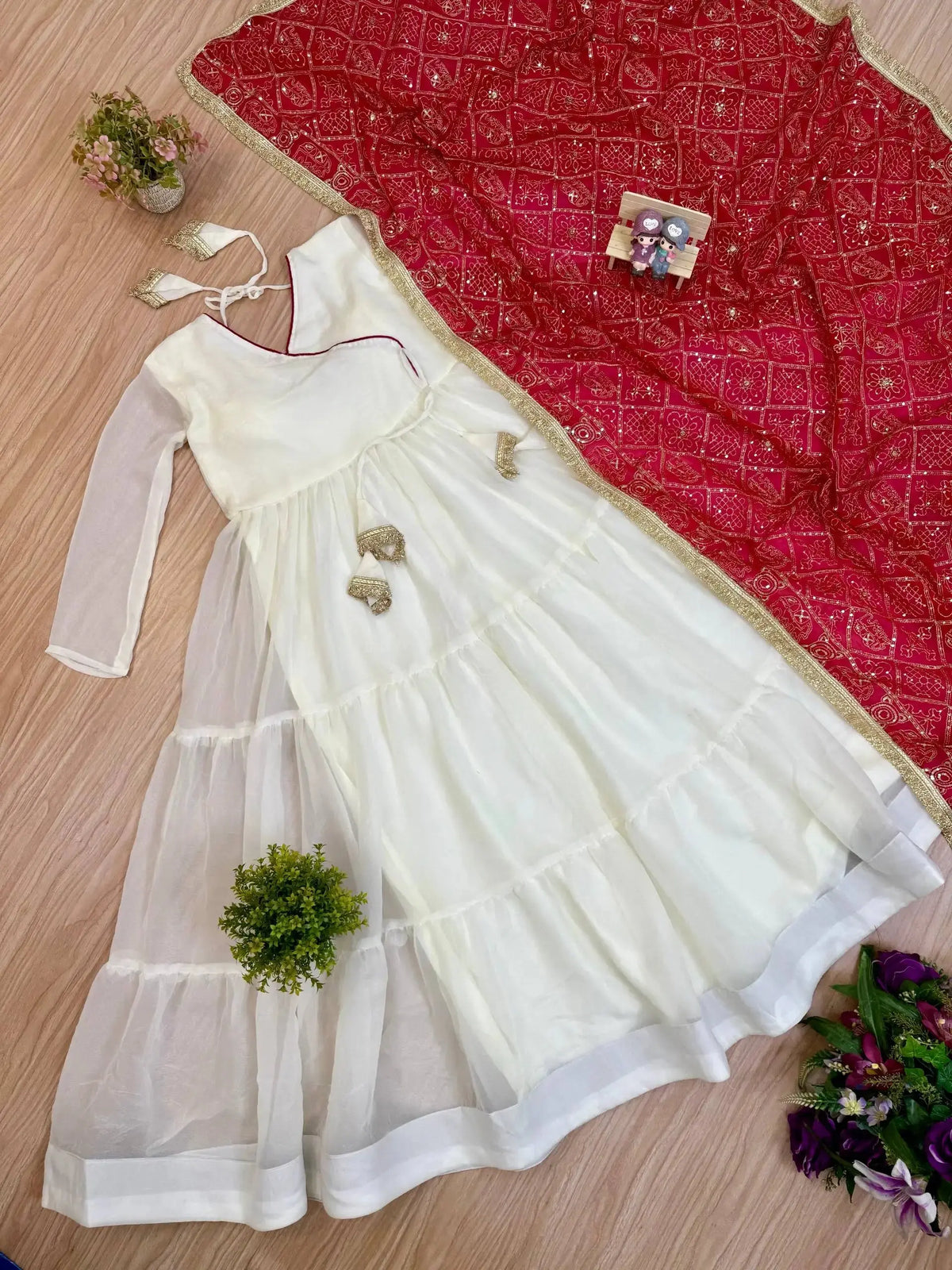 KU217 White Anarkali Suit flat lay – Complete 2-piece set: white tiered Anarkali and dark pink Bandhej dupatta