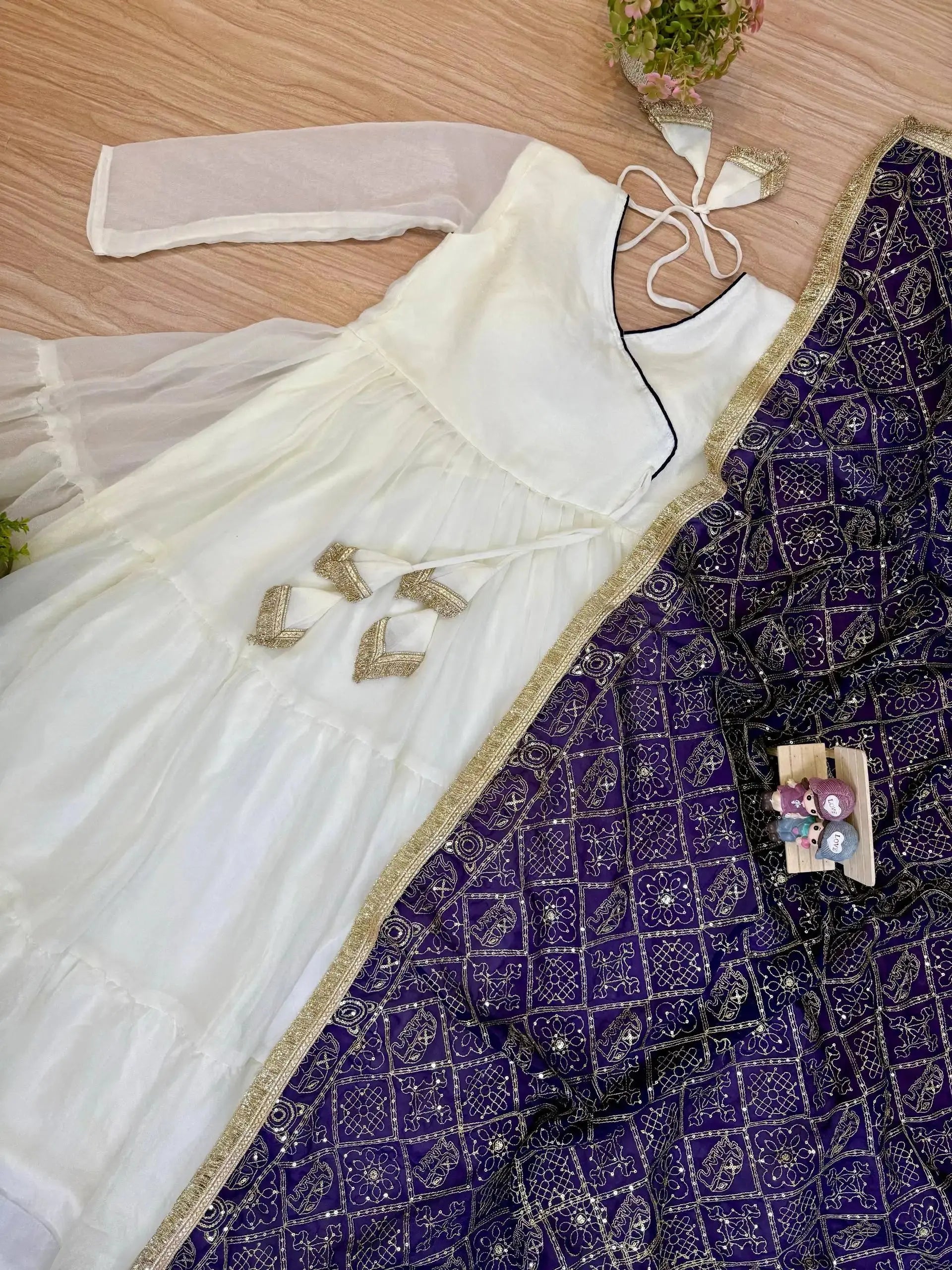 White Anarkali Suit flat lay – suit and purple Bandhej embroidered dupatta with gold border