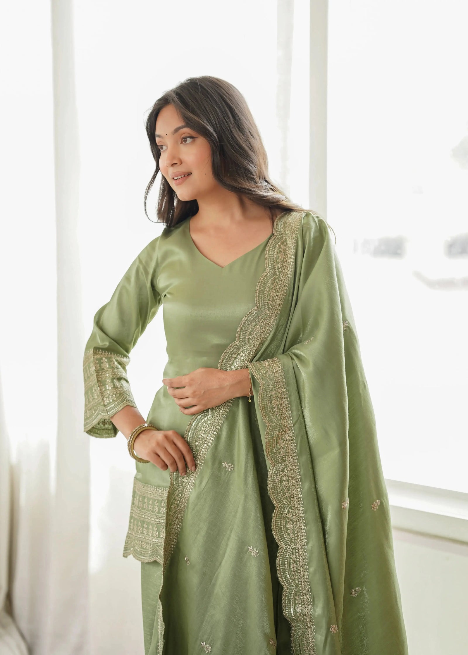 Pista Green Shalwar Suit – embroidered cuff detail matching the scalloped hem
