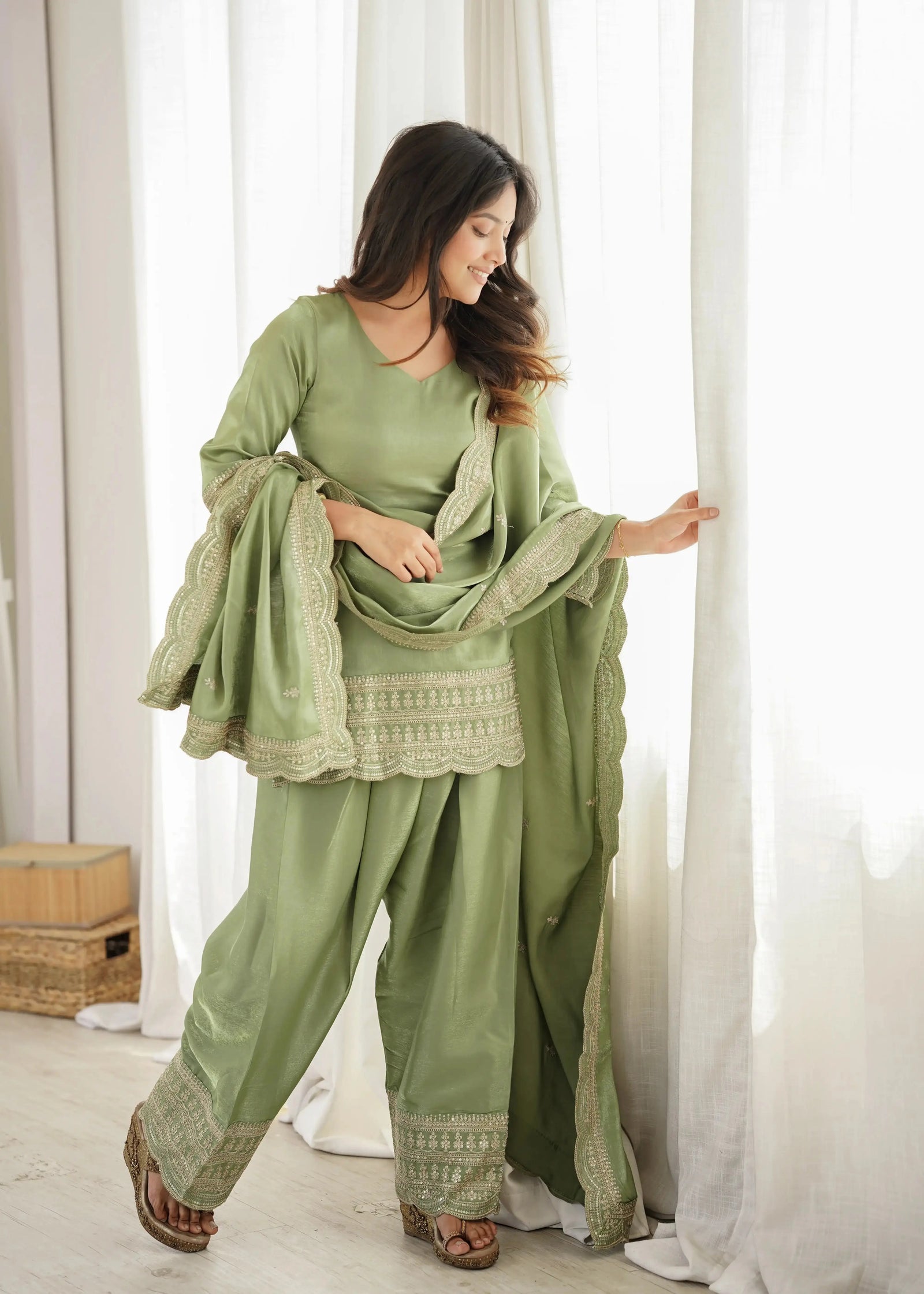 Pista Green Suit – full-length pose highlighting scalloped hem and shalwar silhouette