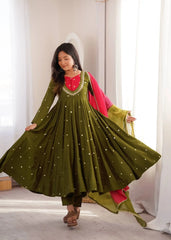 Dark Green Suit – full-length angled pose showing contrast yoke and Anarkali volume