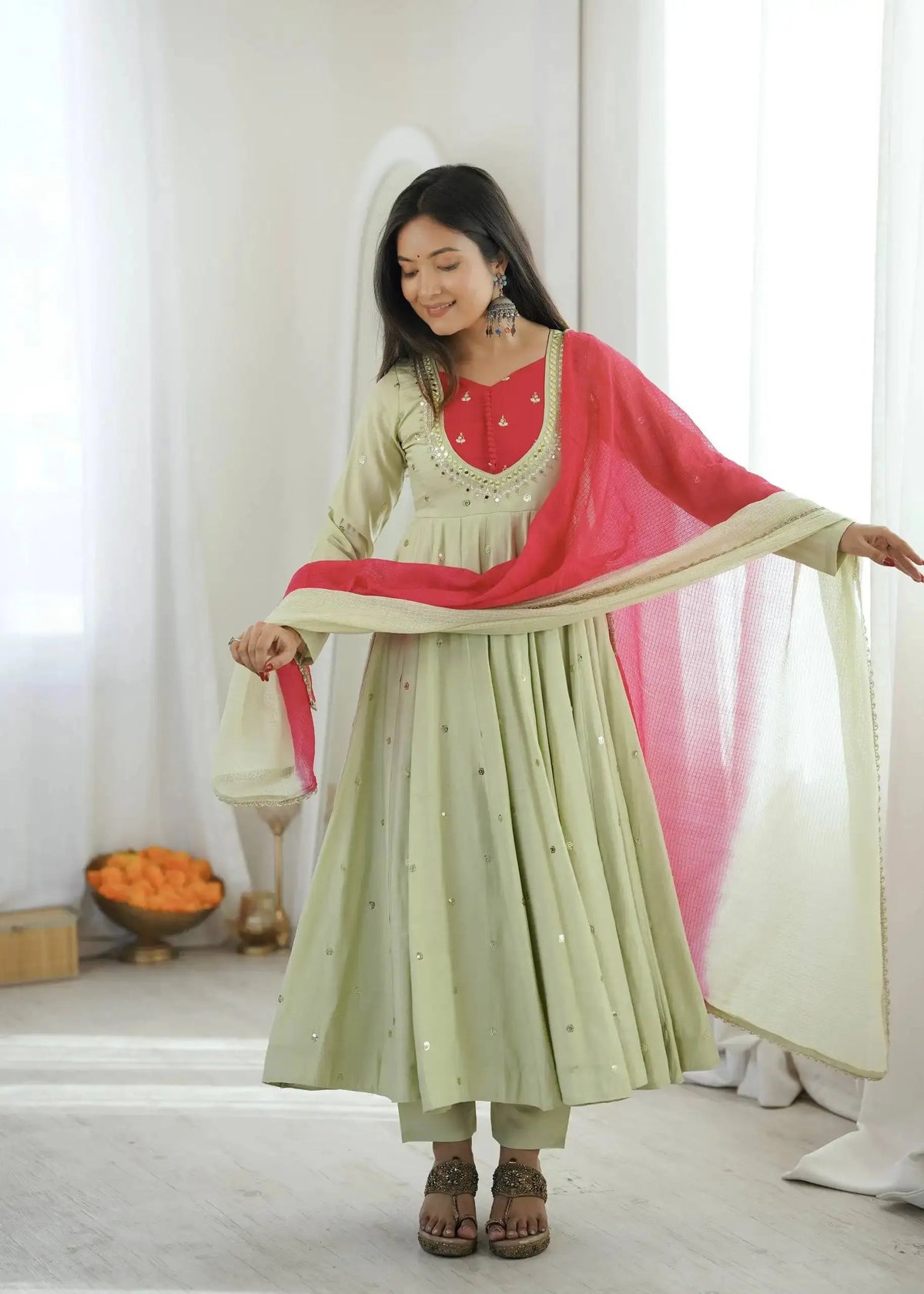 Light Pista Green Embroidered Suit – side view showing Anarkali silhouette and dupatta drape