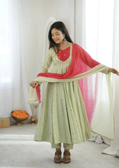 Light Pista Green Embroidered Suit – side view showing Anarkali silhouette and dupatta drape