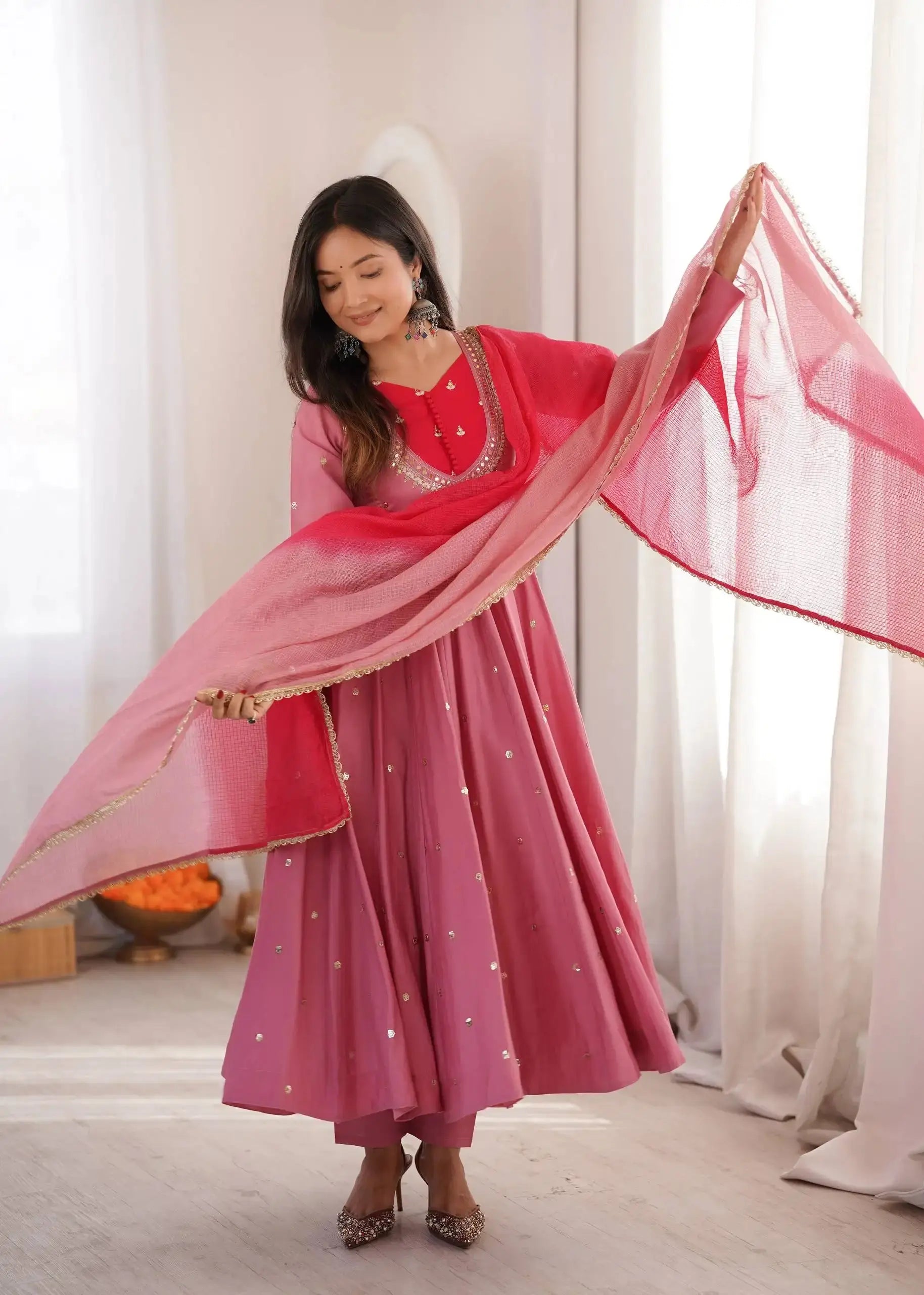 Pink Embroidered Anarkali Suit – full-length walking pose showing flair movement