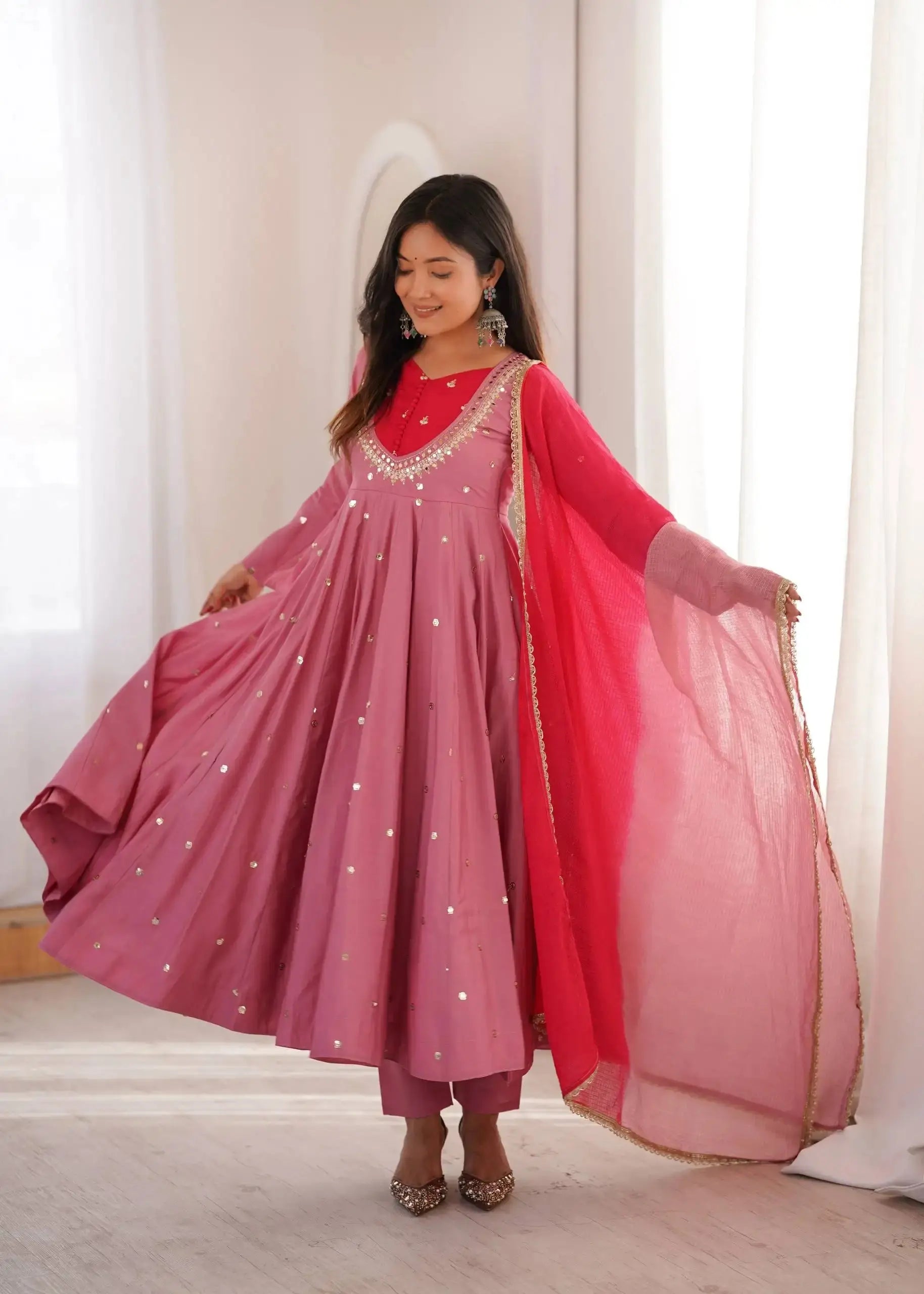 Pink Embroidered Suit – side view showing Anarkali silhouette and dupatta drape