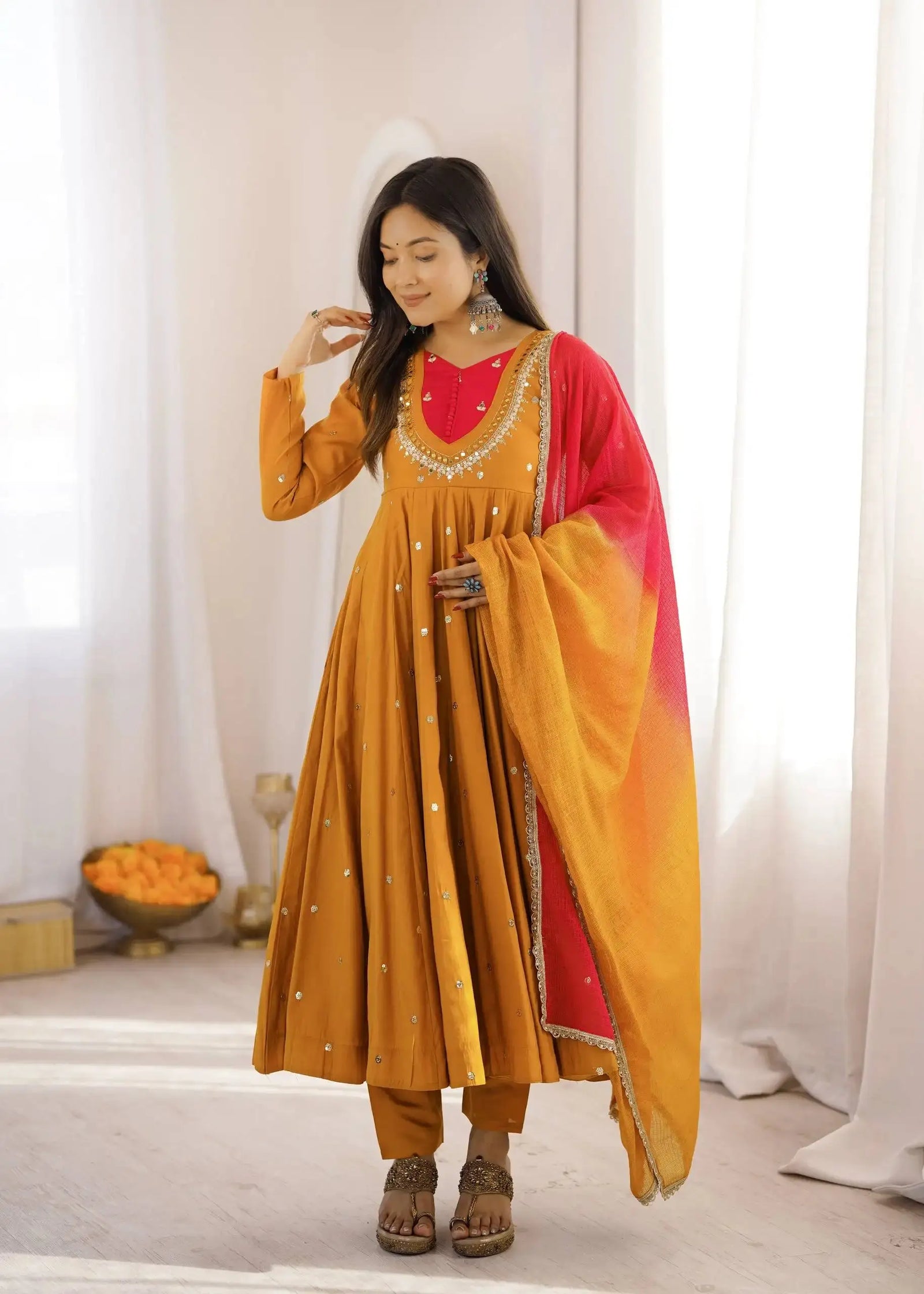 Yellow Embroidered Suit – side view showing Anarkali silhouette and dupatta drape