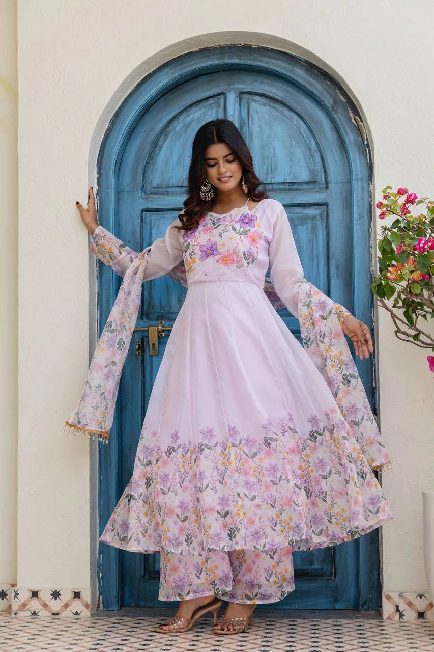 Women's embroidered lavender Anarkali suit set with floral palazzo pants and lightweight printed dupatta.