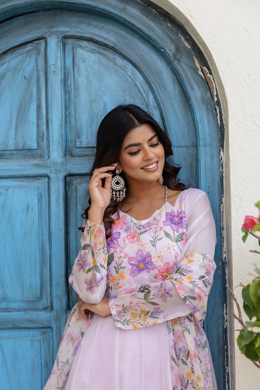 Fashionable light lavender floral ethnic suit with elegant embroidery and coordinated three-piece set.