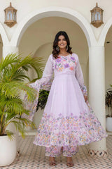 Women's pastel lavender Anarkali suit featuring floral embroidery, printed dupatta, and ethnic elegance.