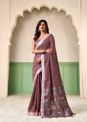 Woman wearing a traditional saree in a decorative setting