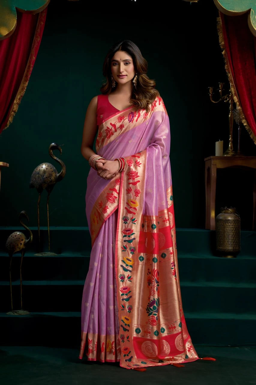 Woman wearing a colorful saree with a dark background