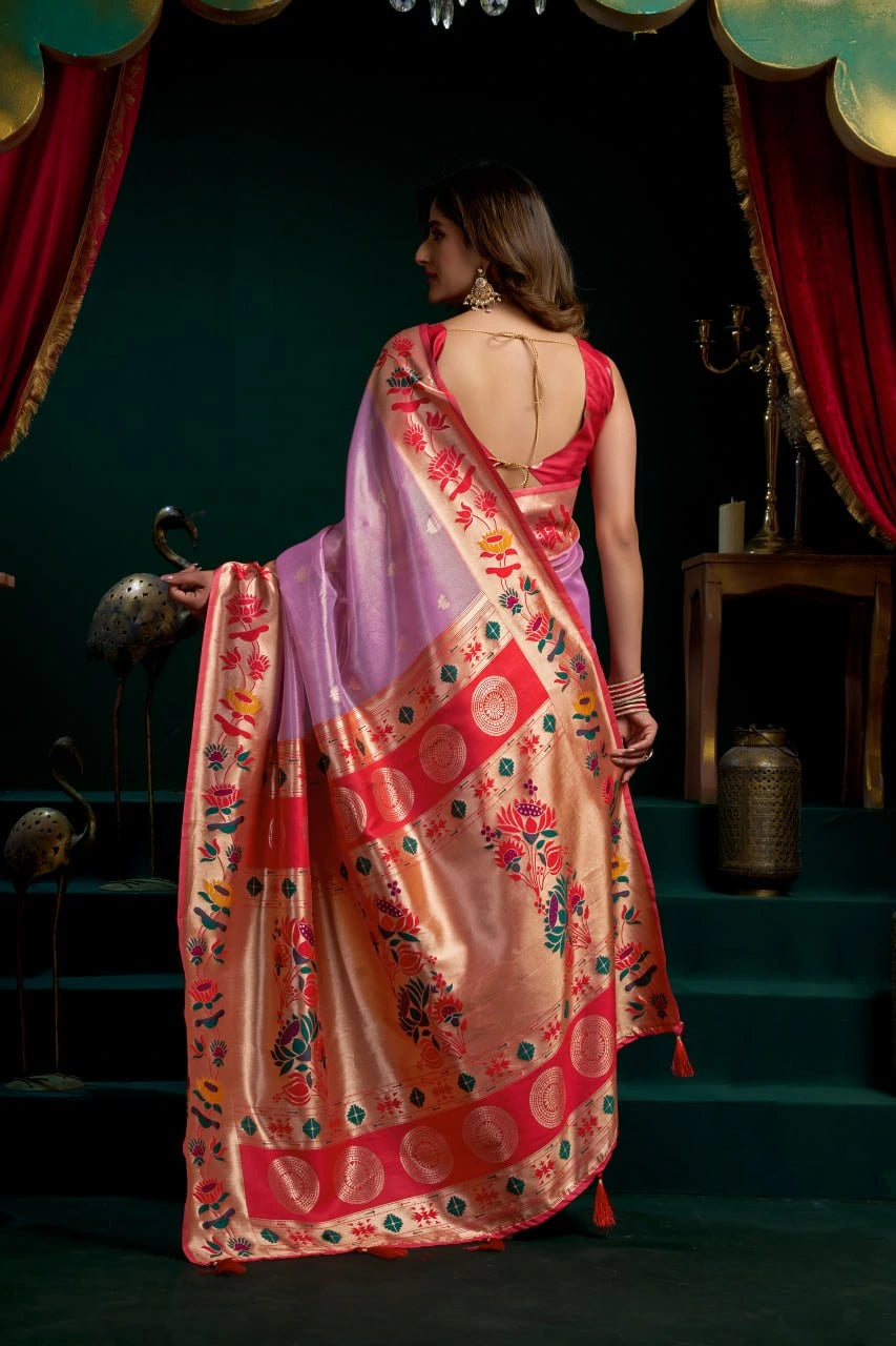 Woman wearing a colorful saree with a dark background
