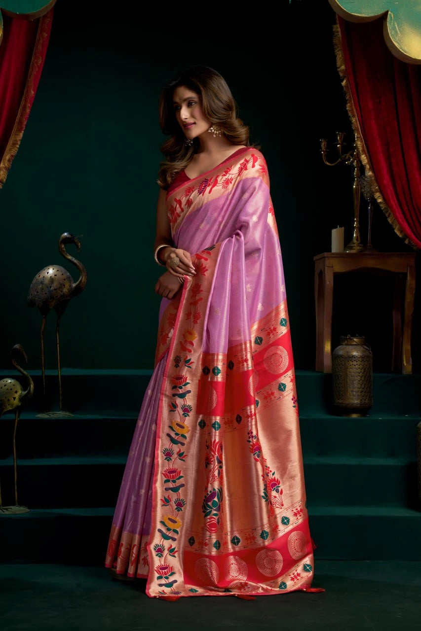 Woman wearing a colorful saree with a dark background