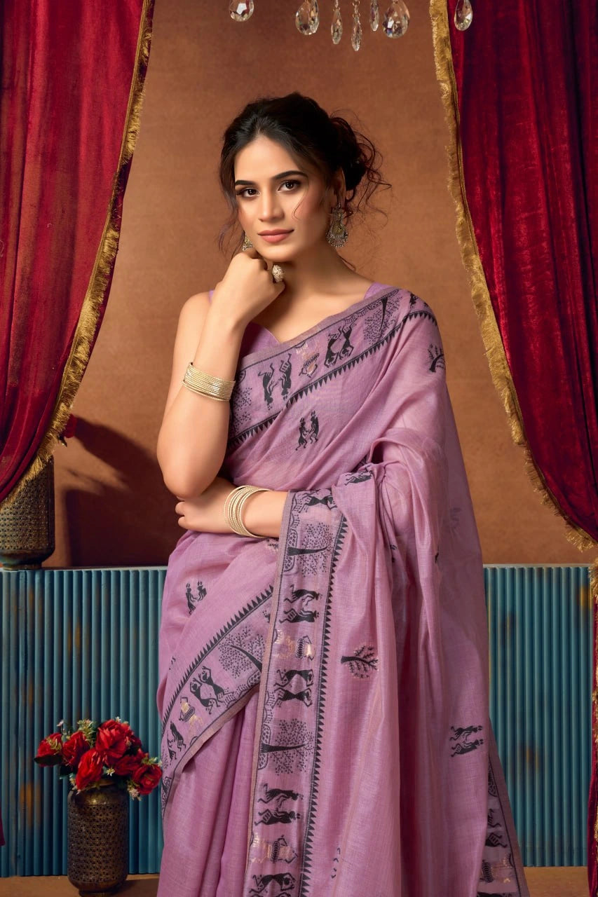 Woman wearing a purple saree with a decorative background