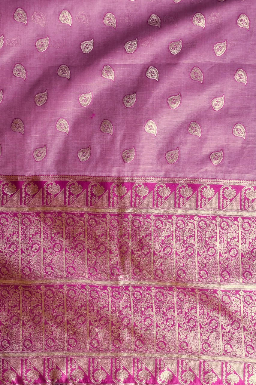 Purple fabric with intricate gold patterns