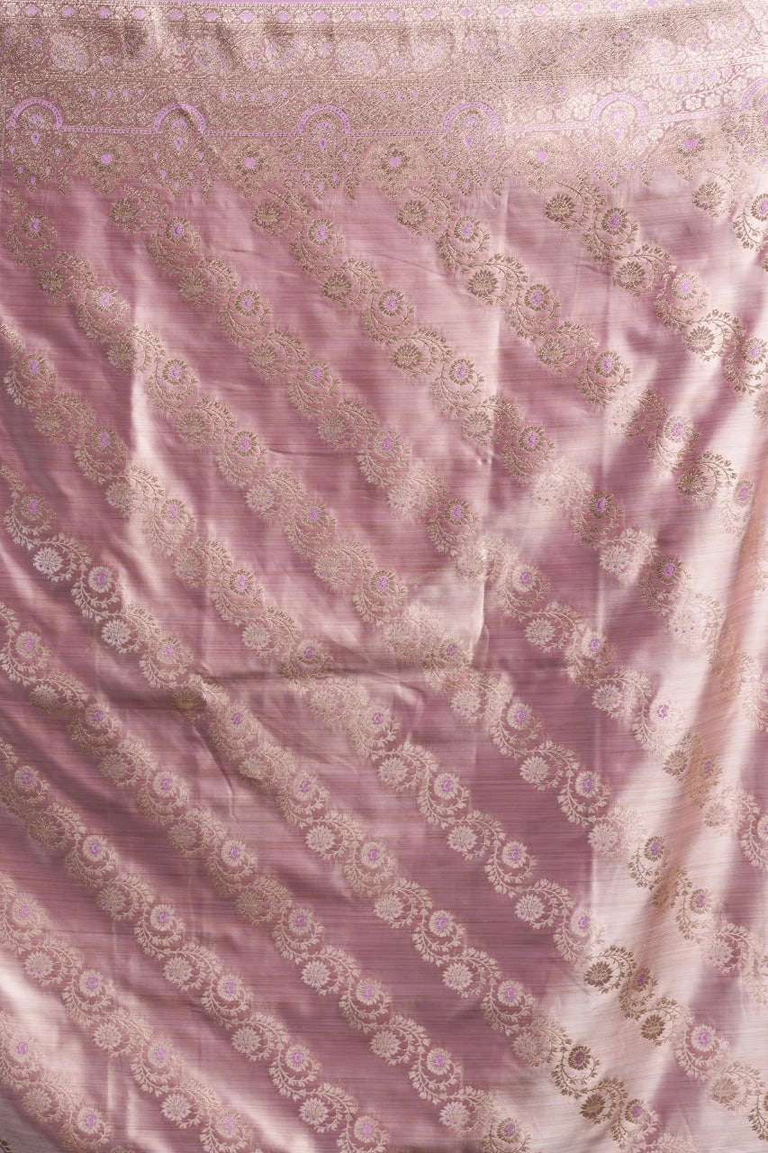 Pink fabric with intricate white patterns