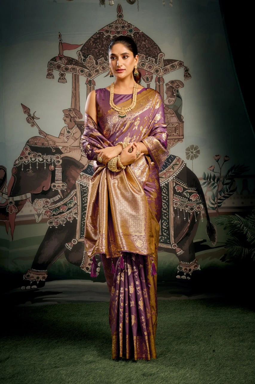Woman in traditional purple and gold outfit with decorative background