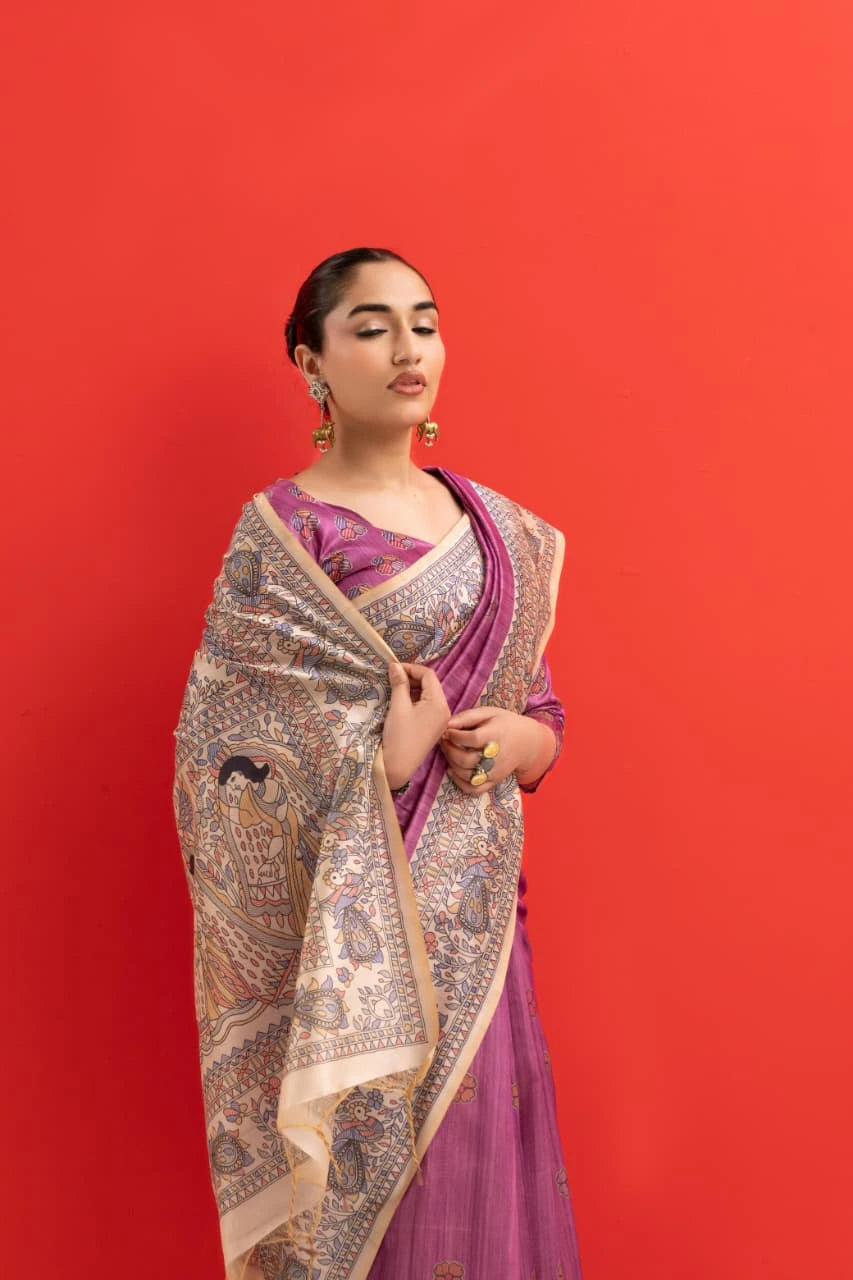 Woman wearing a traditional saree with a red background
