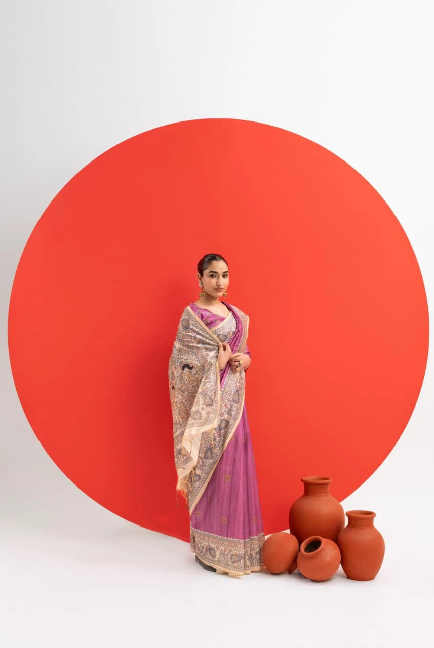 Woman in a traditional outfit standing next to earthen pots against a red circle on a white background