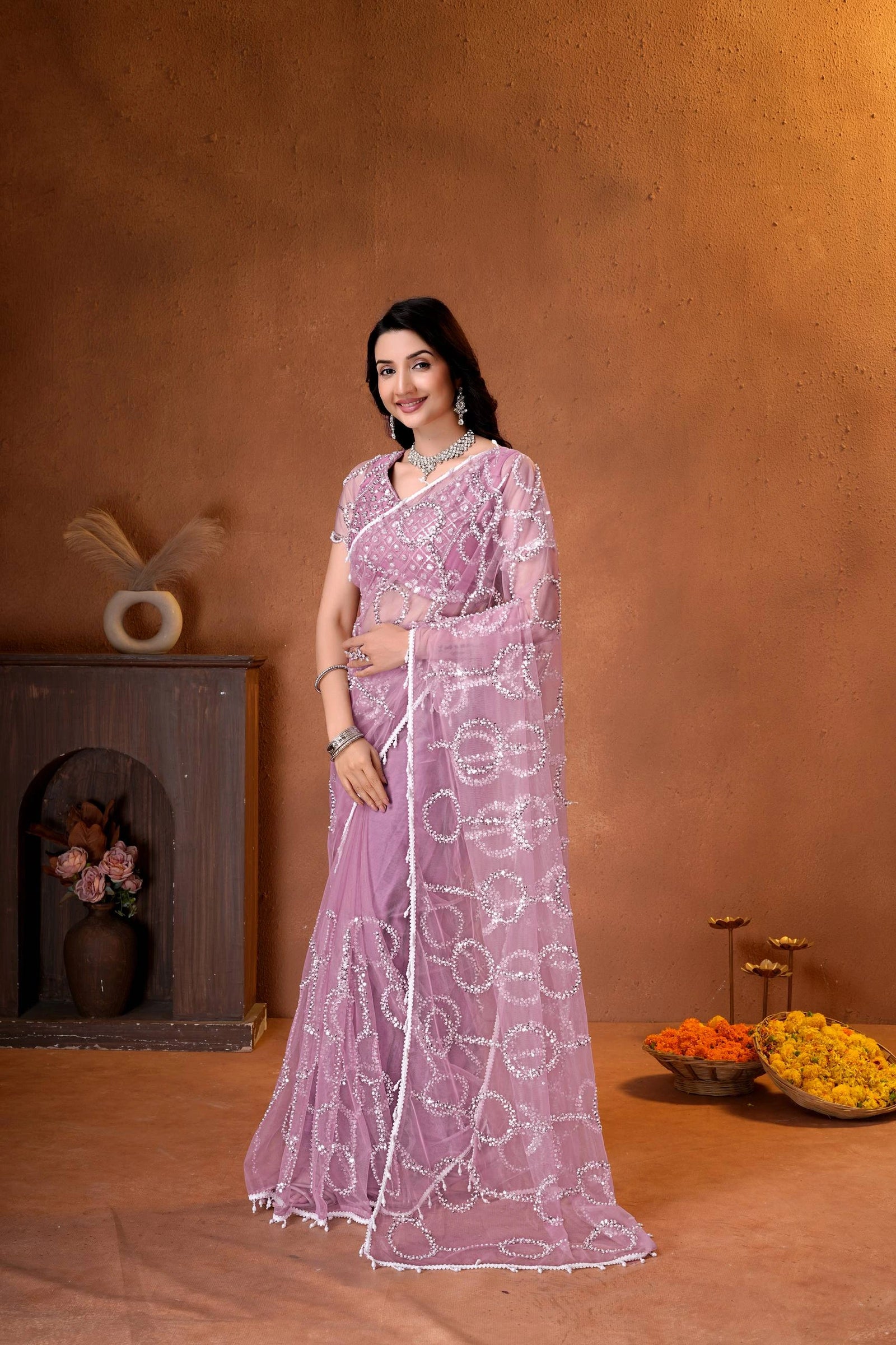 Premium party wear saree with a matching embroidered blouse, sheer embellished pallu, and luxurious ethnic styling.