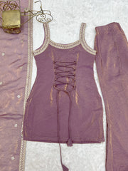 Purple outfit with lace-up design on a textured surface