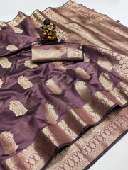 Purple and beige saree with a decorative item on a white background