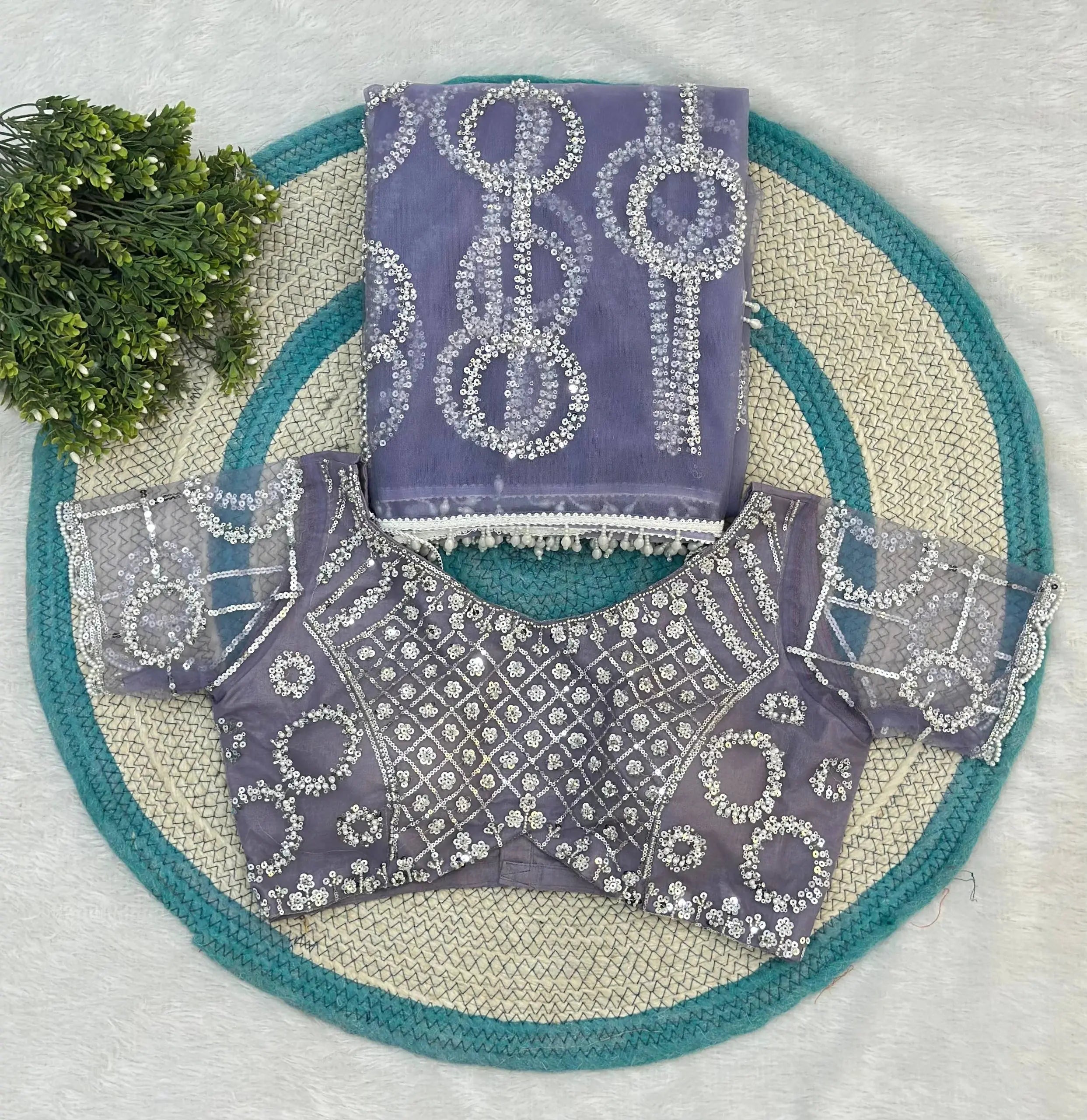 Gorgeous lavender embroidered saree with matching blouse offers sophisticated style, rich detailing, and effortless festive charm.