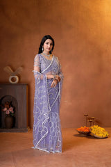 Premium party wear saree with a matching embroidered blouse, delicate beadwork, and a beautifully flowing sheer drape.