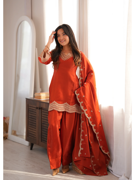 Light Orange Sequins Suit with dupatta draped over shoulder