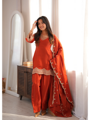 Light Orange Sequins Suit with dupatta draped over shoulder