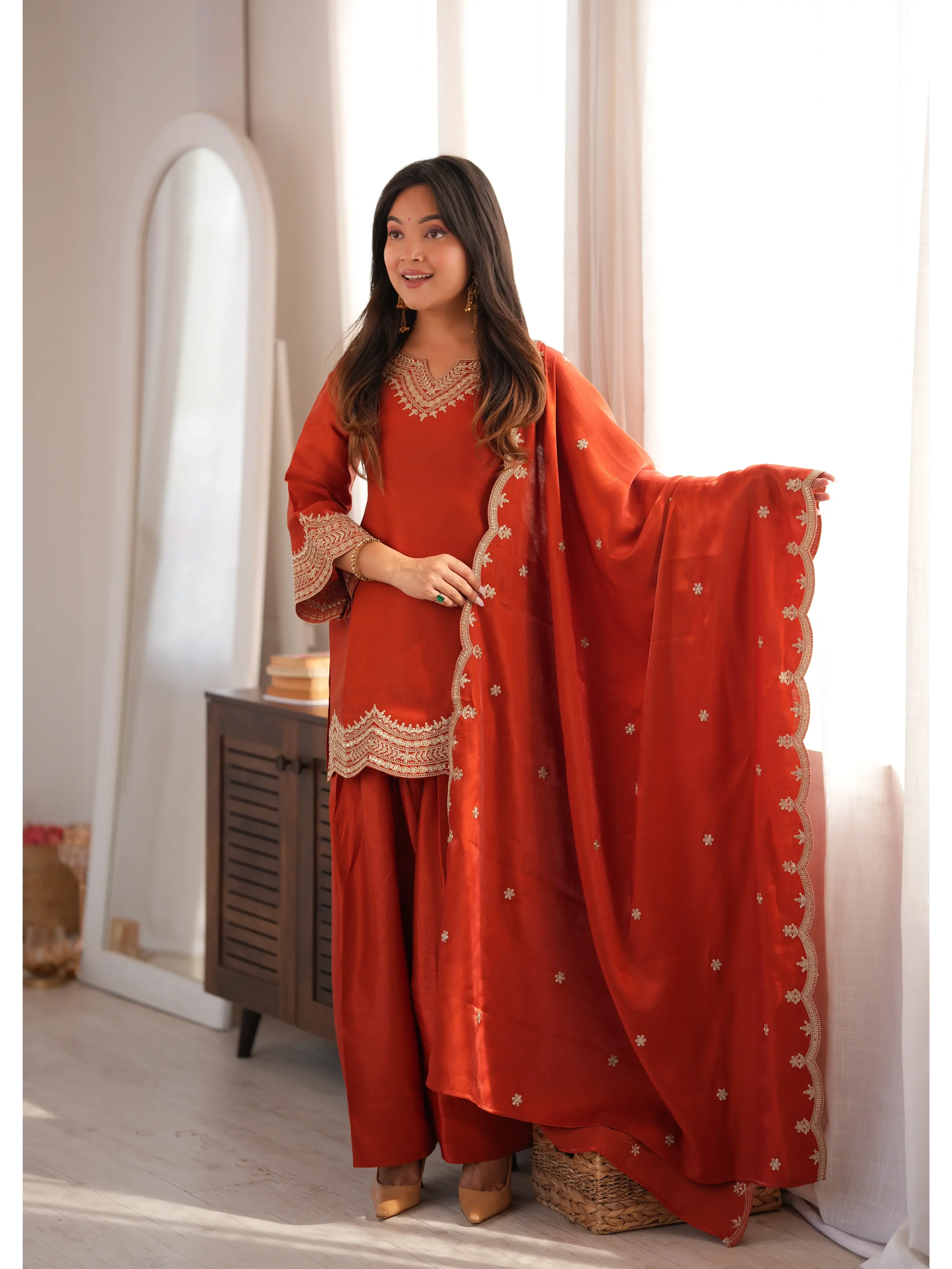 Light Orange Sequins Suit styled with dupatta drape