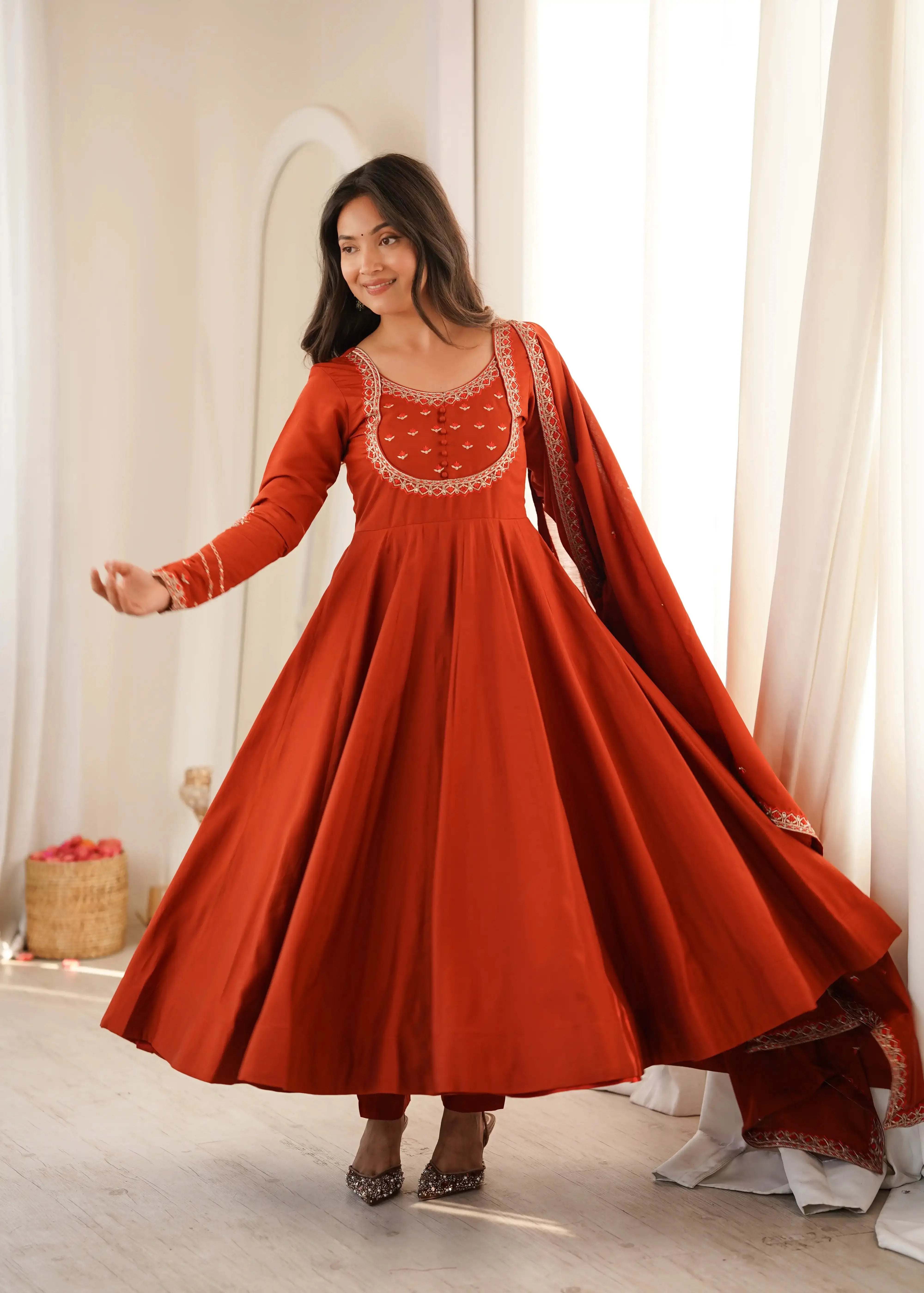 Light Orange Thread Work Anarkali Suit full length front view with dupatta flying