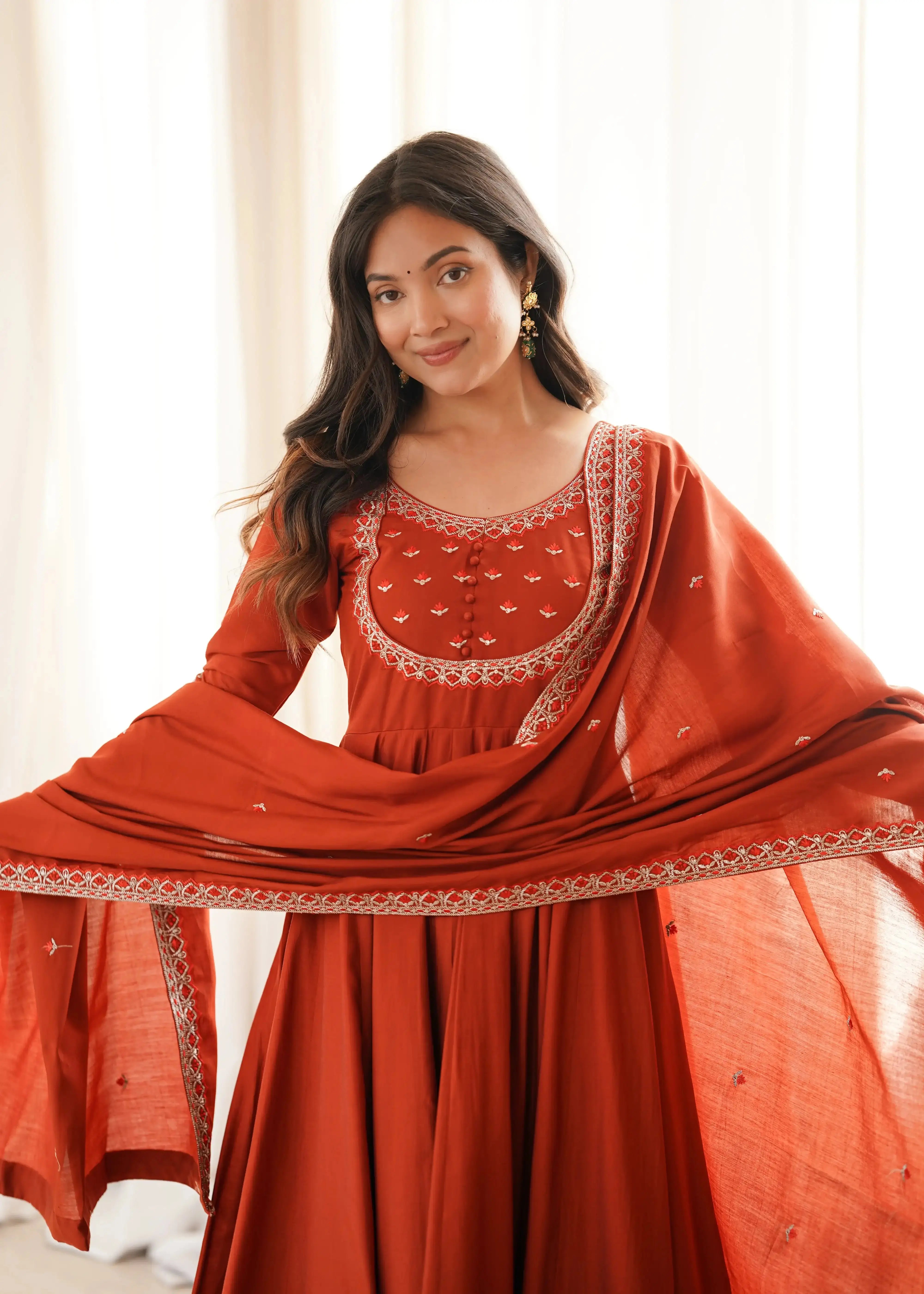Upper body close-up of Light Orange Thread Work Anarkali Suit with dupatta