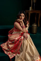 Woman in a traditional saree with a dark background