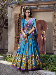 Stylish sky blue Kalamkari printed saree with colorful heritage motifs, purple border, and festive elegance.